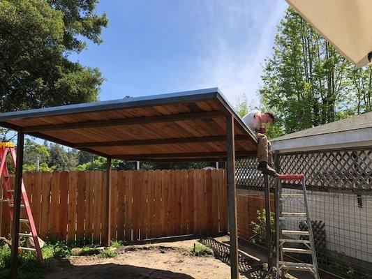 back yard pergola made out of steel and redwood