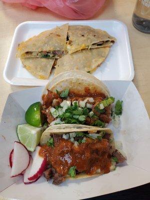 Al pastor and lengua tacos, and a carnitas mulita