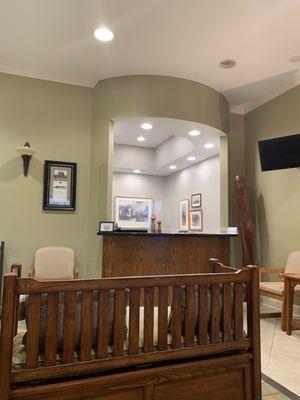 Waiting room and reception desk.