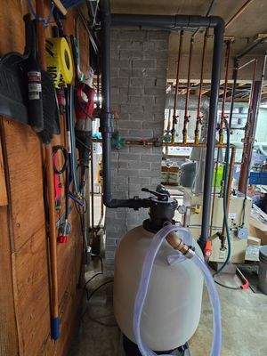 1.5 Haywood horsepower sanfilter installed in the homeowner's basement zoned and connected to the boiler.It now has hot water for your pool