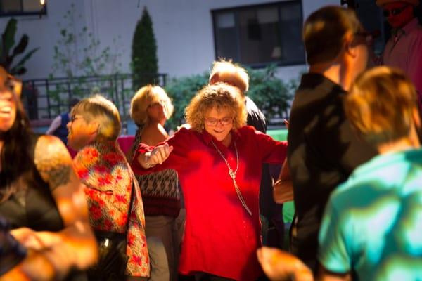 Dancing at the 60th Anniversary "Summerbash" outdoor party