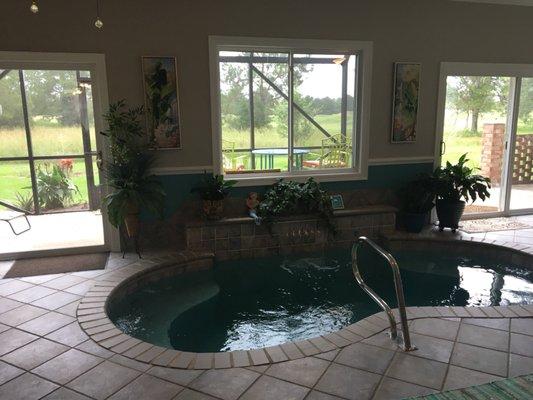 This sunroom is great for enjoying a spa or pool; it just needed the right colors and touches to make it more inviting.