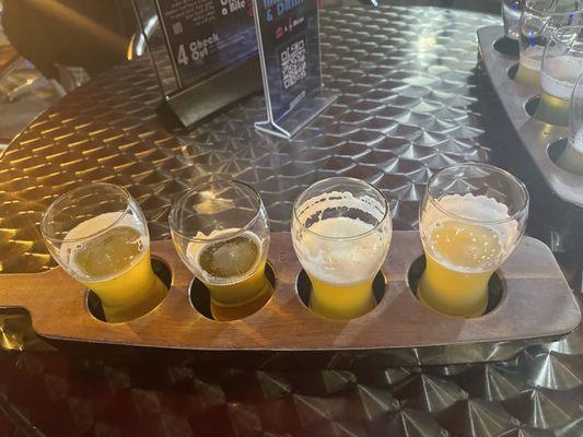 My wife's beer flight of IPAs ... after some sips. Yum!