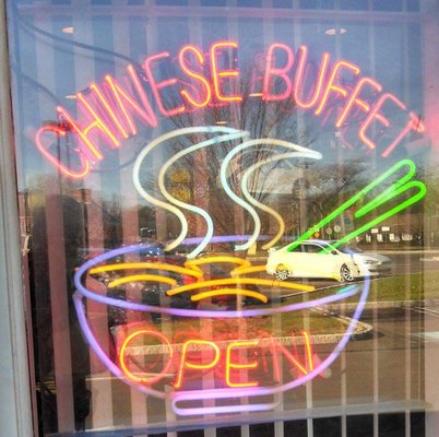 The neon sign in the window