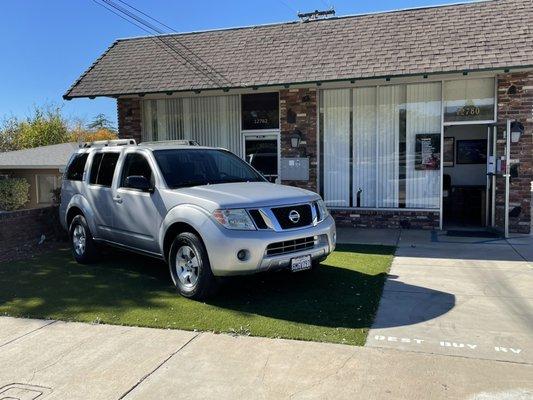 Our office. Pictured is a beautiful 2010 Nissan Pathfinder with 54k miles we recently sold.