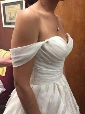 I had sleeves added to my dress for my ceremony that could easily hide away for my reception.  how it turned out