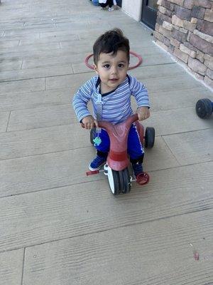 Riding my bike on the playground at children's learning adventure