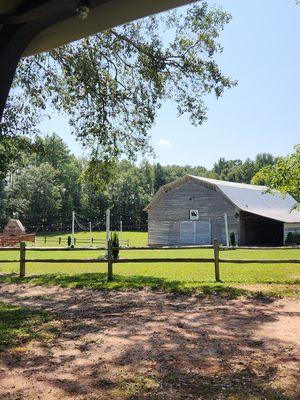 Outside the Barn at Forevermore Farm. To the left is a deck with  an outside fireplace.