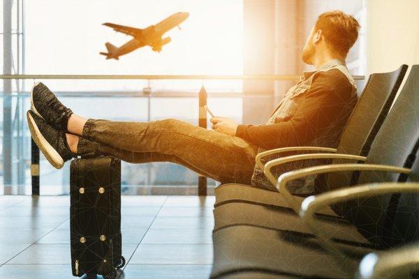 e-Visa Traveler in Airport Waiting for his Flight