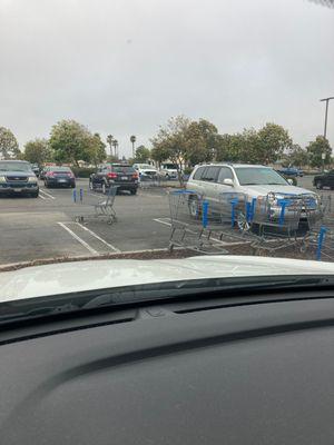 Saturday morning, and carts and trash abound in the parking lot. Show some community pride WalMart!!