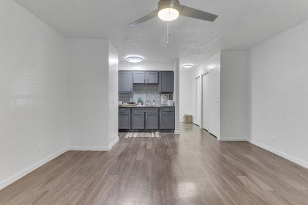 Open concept living with view of kitchen from living room.