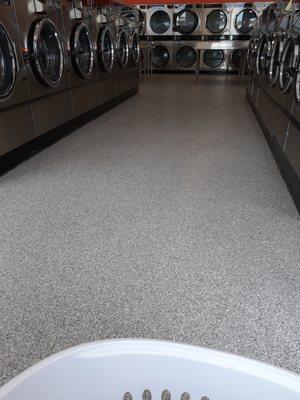 Lots of washing machines and dryers very clean.