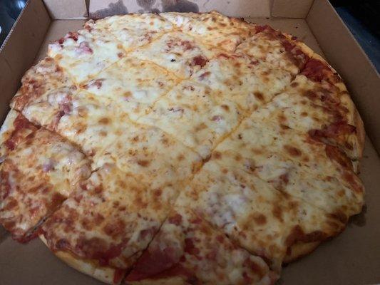 Pizza with Pepperoni, Bacon and Canadian Bacon. Toppings are underneath the cheese.