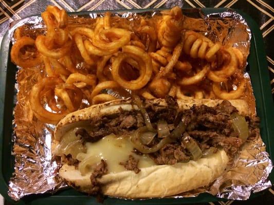 Philly cheesesteak and curly fries