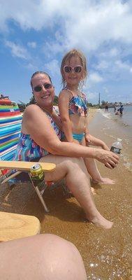 Me and my granddaughter hanging out with our feet in the water