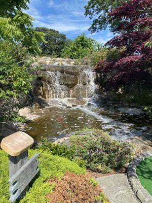 This is a nice waterfall in the middle of the course. It actually helps cool down the day