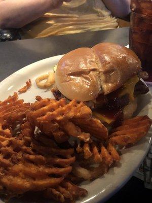 Brisket sandwich with waffle fries.