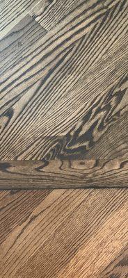 Not only does the floor stain and wood NOT MATCH, there are streaks and patches.