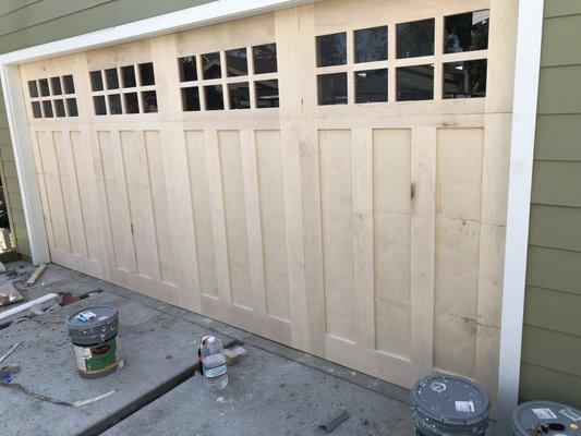 Custom wood with windows double car garage door