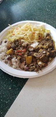 Curried goat, rice and peas, steamed cabbge