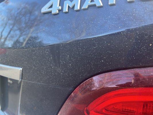 The whole back of the SUV is still filthy.  Perhaps they need to run it through the car wash in reverse.