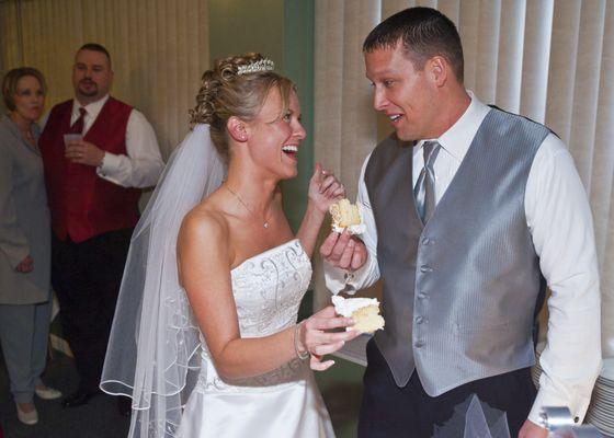 Carrie and Robert anticipate eating cake.