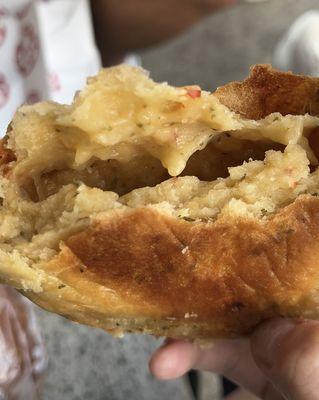 Gooey inside of the cheese empanada