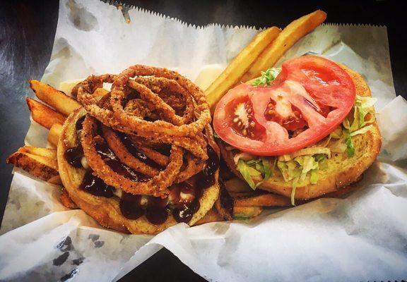 Our Western burger, a quarter pound patty topped with BBQ sauce, cheese and fried onions!