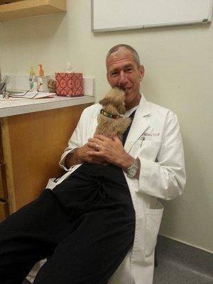 Dr. Miller with a new puppy coming in for a wellness check