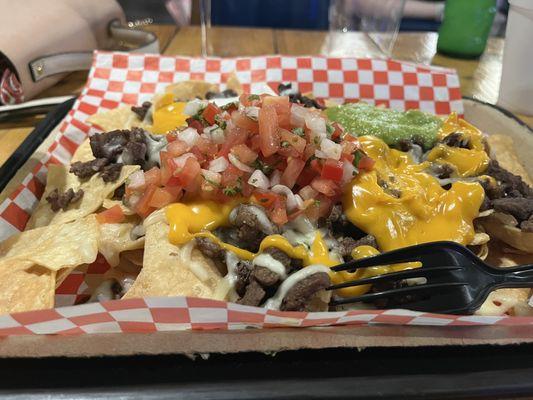 Loaded nacho's with 'nacho cheese'? Perfect for a ball game, Mexican Restaurant, not so much.