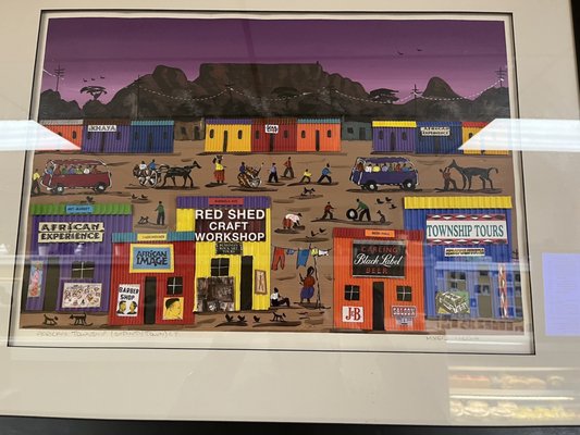 I noticed this artwork in here today as I was waiting on my breakfast sandwich. It's called "African Township". I'm surprised but I love it!