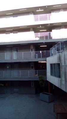 There are five floors and to the right of the picture is a social meeting room with a TV and chairs tables.