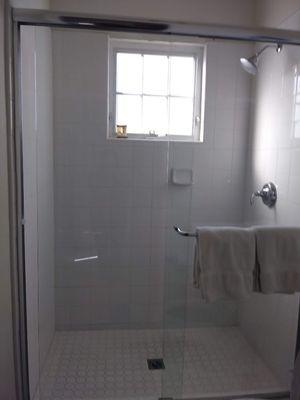 Shower glass doors are cleaned with Lime-away all the time to keep them spotless.