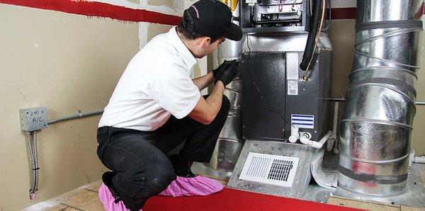 Our Technician Installing a New Furnace!