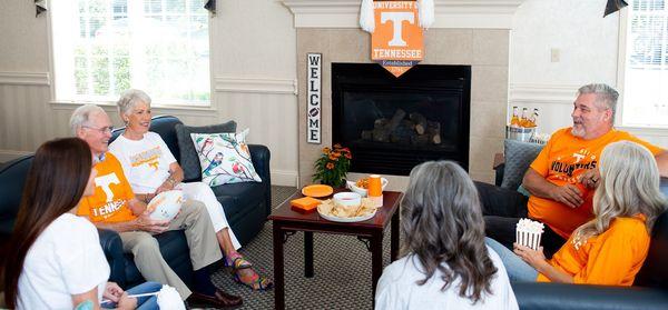 Residents watching a UT game together.