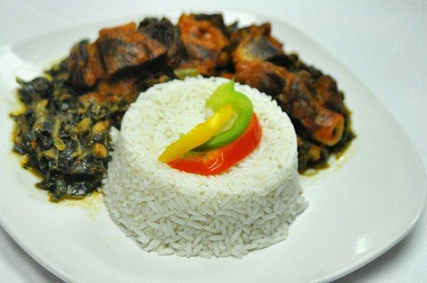 White rice and vegetable sauce served with a choice of meat or fish