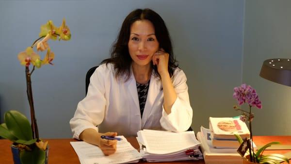 Dr. Hu at her desk