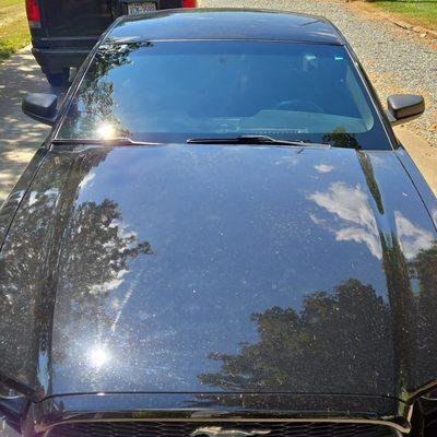 Windshield replacement on a 2014 Ford Mustang.