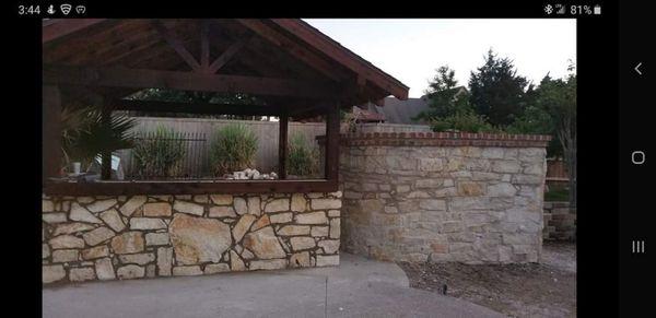 Natural stone walls, outdoor kitchen and cedar pavilion