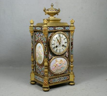 L Marti gilt bronze, champlevé, & porcelain mantle clock Sold for $33,600