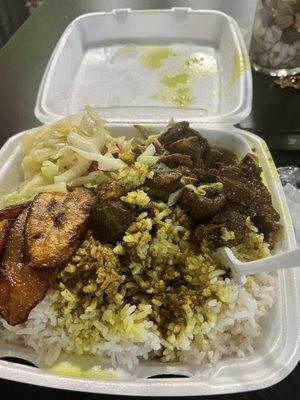 Curry Goat, white rice, steam cabbage and plantain. Yummy yummy