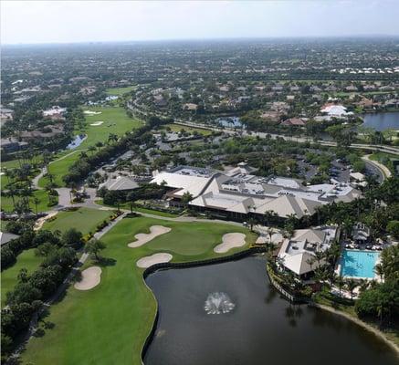 Aerial View of St Andrews Country Club's Clubhouse, Lakeside and the pool along with the pool and golf course.