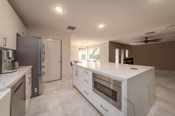 Our customers chose to have an open, bright and clean aesthetic with our glossy white kitchen cabinets.