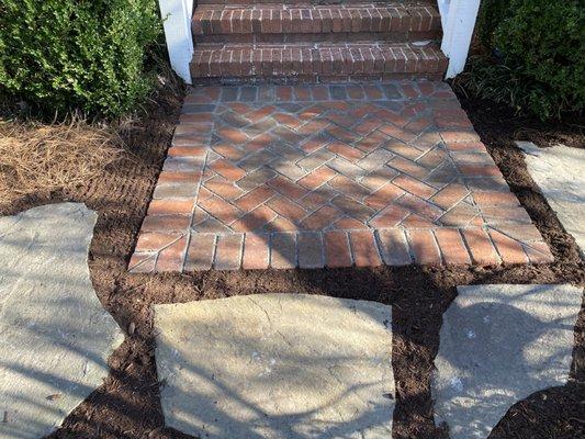 Installled brick Harringbone pattern, mulch and flag stone!