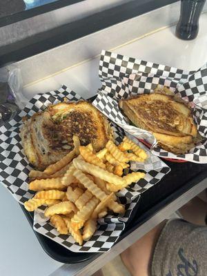 Pesto tomato grilled cheese (daily special) and jalapeño popper grilled cheese