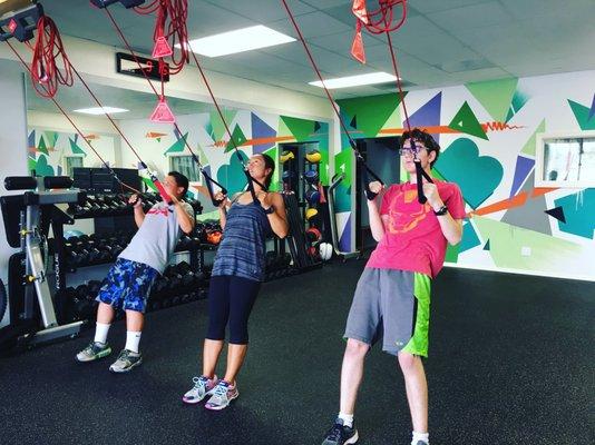 Small Group Fitness Class using suspension training system.