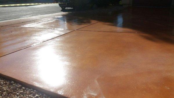 Stained concrete, sealed with clear polyurethane with slip resistance granules.