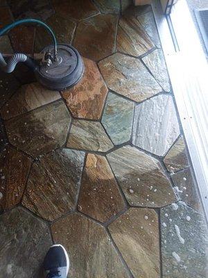 We clean stone floors too. Look at that result.