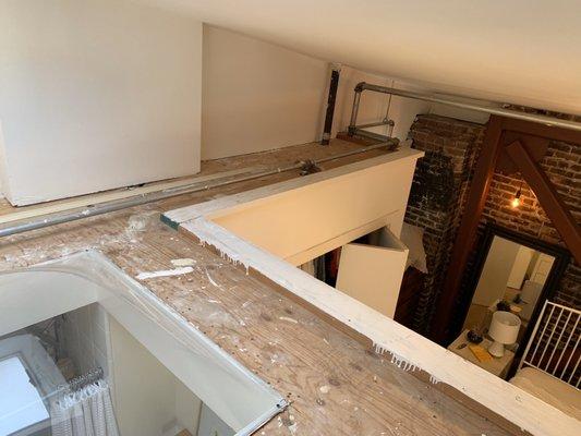 They climbed up to clean the debris on top of a raised skylight