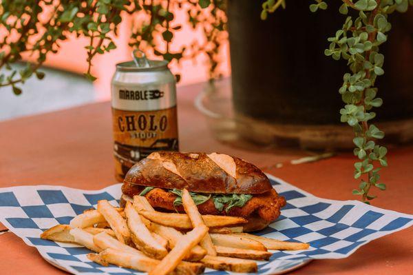 Chicken Schnitzel Sandwich with Arugula and Lemon Mayo, try it with a side of fries and Marble Brewing's Cholo Stout!